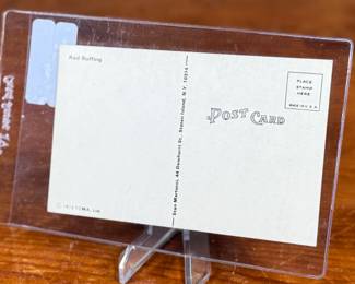 This lot features a vintage, autographed postcard featuring Hall of Fame pitcher Red Ruffing, protected in a rigid plastic card saver. 