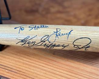 This lot features a signed baseball bat by baseball players Ken Griffey Jr. & Lenny Randle.