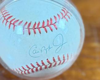 This lot features a signed baseball by 1991 A.L. MVP, Cal Ripken Jr. Comes with a display case.