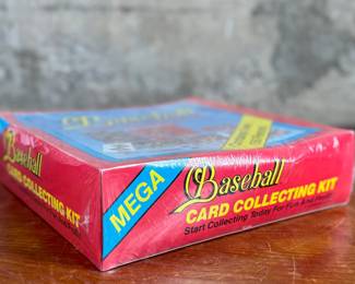 This lot features a 1990 Mega – Baseball Card Collecting Kit, still with the original plastic wrap. The kit contains over 150 pieces!