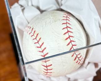 This lot features a baseball with twenty-six (26) autographs from the 1965 Los Angeles Dodgers. Notable signatures include Walter Alston, Don Drysdale, and Sandy Koufax. Accompanied in a display case with authentication papers from Beckett.
