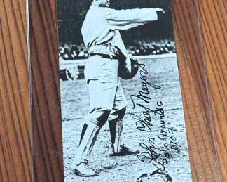 This lot features a collectible vintage black-and-white photograph or postcard featuring baseball catcher Chief Meyers in a throwing stance at the Polo Grounds. The image is dated 1909 and features his name, a printed signature, and a handwritten-style note.