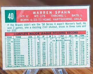 This lot features a vintage 1959 Topps baseball card featuring Milwaukee Braves pitcher Warren Spahn. 