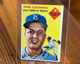 This lot features a 1954 Topps Tommy Lasorda Brooklyn Dodgers Rookie Card #132. 