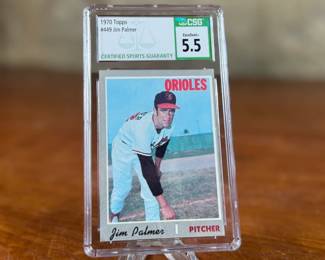 This lot features a 1970 Topps Baseball trading card featuring Jim Palmer of the Baltimore Orioles. It is graded as Excellent+ 5.5 by Certified Sports Guaranty (CSG). 