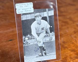 This lot features a vintage, autographed postcard featuring Hall of Fame pitcher Red Ruffing, protected in a rigid plastic card saver. 