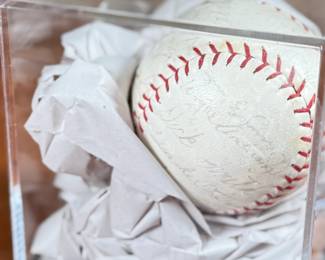 This lot features a baseball with twenty-six (26) autographs from the 1965 Los Angeles Dodgers. Notable signatures include Walter Alston, Don Drysdale, and Sandy Koufax. Accompanied in a display case with authentication papers from Beckett.