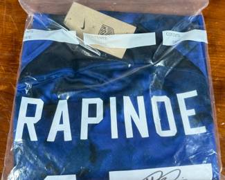 This lot features a signed jersey (with tags) by former American professional soccer player. Authenticated as shown in photos.