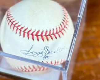 This lot features a signed baseball by Reggie Jackson, 1993 Hall of Famer with 563 home runs. Comes in a display case.