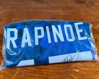 This lot features a signed jersey (with tags) by former American professional soccer player. Authenticated as shown in photos.