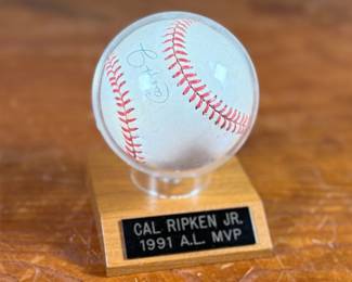 This lot features a signed baseball by 1991 A.L. MVP, Cal Ripken Jr. Comes with a display case.