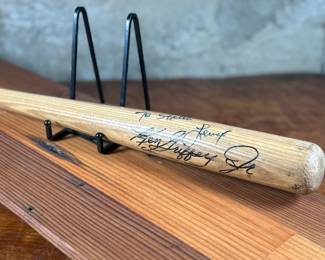 This lot features a signed baseball bat by baseball players Ken Griffey Jr. & Lenny Randle.