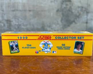 This lot features a 1990 Score Baseball Collector Set containing 704 player cards and 56 “Magic Motion” trivia cards. Still sealed in original plastic wrap. Features iconic cards like the Bo Jackson “shoulder pads” card and Frank Thomas rookie card.