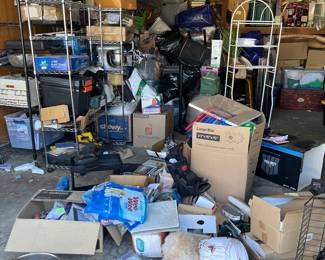 Cluttered view of the amount of items for sale (many in boxes) 