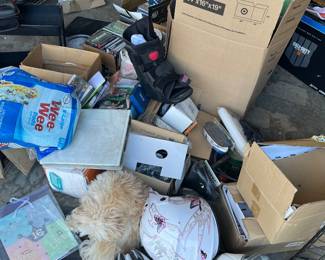 Close up of some items for sale. Helmets, dvds, toys, shelves, 