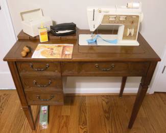 singer sewing machine in cabinet