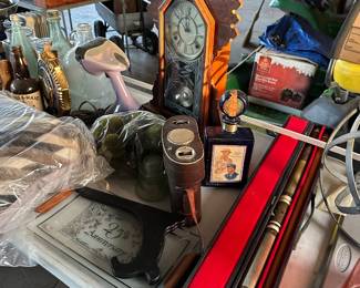 Antiques vintage clock, bottles, pool stick, vintage binoculars, decor sign