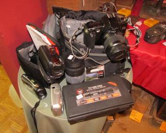 TC1200, Canon lens 75-300mm, Canon RebelX S, Kodak Easy Share, Olympus Stylus, Panasonic SDRH85 movie camera, 