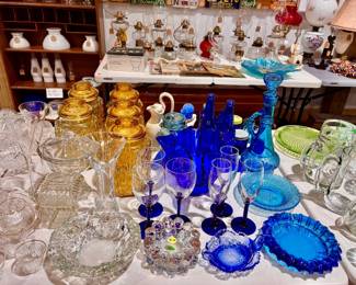 Amber, blue, crystal, and cobalt blue glass ware