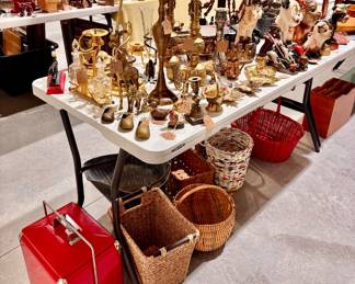 Lots of vintage brass items, baskets, and candle stick holders