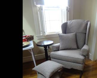 Wingback chair matches the couch in the lower apartment