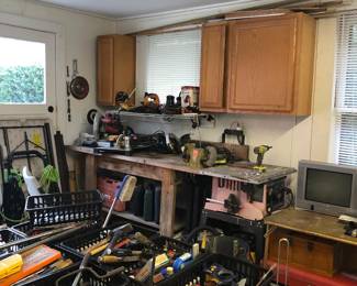 Workshop tables, hand tools, power tools, tool boxes, generator, power washer, garden tools, wheelbarrow.
