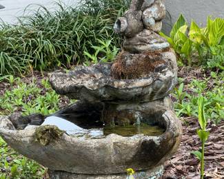 This fountain was found underground when that home was built. It was put back together but the head is missing.