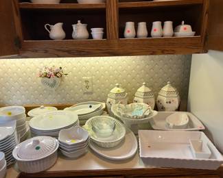 Many white bowls and dishes