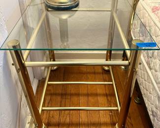 20x24” Brass base, glass top table $18. (2) available