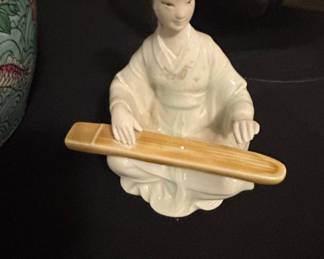 Porcelain Figurine of a Woman Playing a Guqin