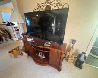 . . . large flat-screen TV and TV stand