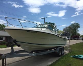 . . . 1992 Pursuit 2350, 975 hours, walk-around cuddy cabin, 5.7 Magnum engine, Mercruiser trolling motor and much more!