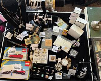 (A) No 5 Chanel Perfume, (B) No 5 Chanel Perfume, Meowth Holo Promo Card, Bracelets, 14k Figaro Chain Bracelet, Necklaces, Legoland Canada Post Truck, 14k Chain Bracelet, Omega Seamaster De Ville, 14k Hoop Earrings, 10k Pearl Ring, 14k Purple Stone Ring, 14k Ultramar Watch, 14k Madonna Pendant, 10k Tigers Eye Ring        