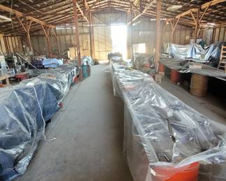 three 50' tables covered with tools and parts