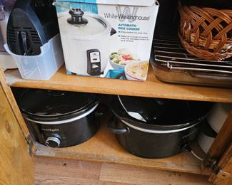 lots of cookpots and kitchen gadgets
