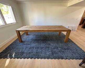 Restoration Hardware Russian Oak Table. 108". Anthropologie rug. Approx 12'x9'.