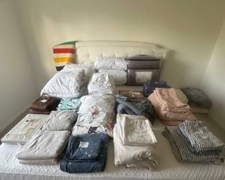 Various sized bed linens. King bed.