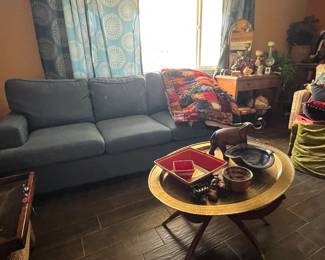 Couch, quilt, pillows, table