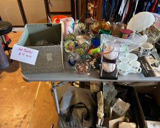 Belt buckles, glass paper weights, air mattress, musc