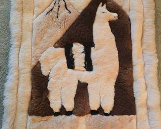 Fir wall hanging with patchwork hide backing