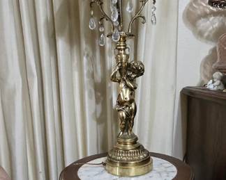 Variety of occasional tables... this one is octagon with marble top displaying a heavy brass lamp