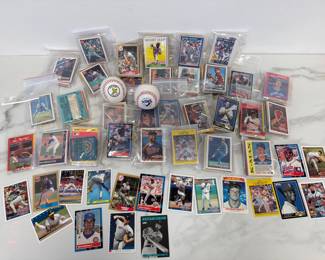 Lot 981  90s Baseball Cards  N Ryan  R Johnson  Tommy John  K Puckett  K Gibson  B Jackson  G Brett  S Sosa  R Sandberg  R Clemens  W Boggs  C Schilling  K Griffey SrJr  D Justice  K Caminiti  R Henderson