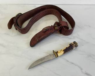 Lot 1047  Schrade Uncle Henry Golden Spike Fixed Blade Knife w Scabbard Leather Belt