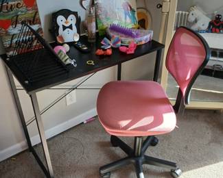youth desk with pink chair; various wall art and posters