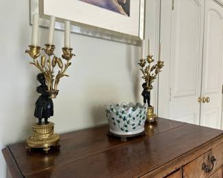 A pair ofLouis XVI style gilt and patinated bronze three light candelabra.