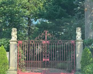 Pair of early 20th century English wrought iron entranceway gates (including two pedestrian gates) with central crest and Tudor rose decoration in all corners . (Lions sold separately.)
