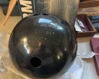 Vintage Brunswick Black Diamond bowling ball with weight markings.