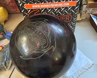 A used Ebonite Stinger 2-piece pearl reactive bowling ball.