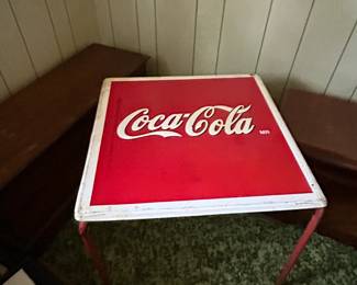 There are 4 metal chairs that go with table