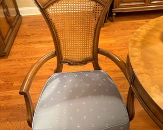 8. Cane back upholstered chairs.